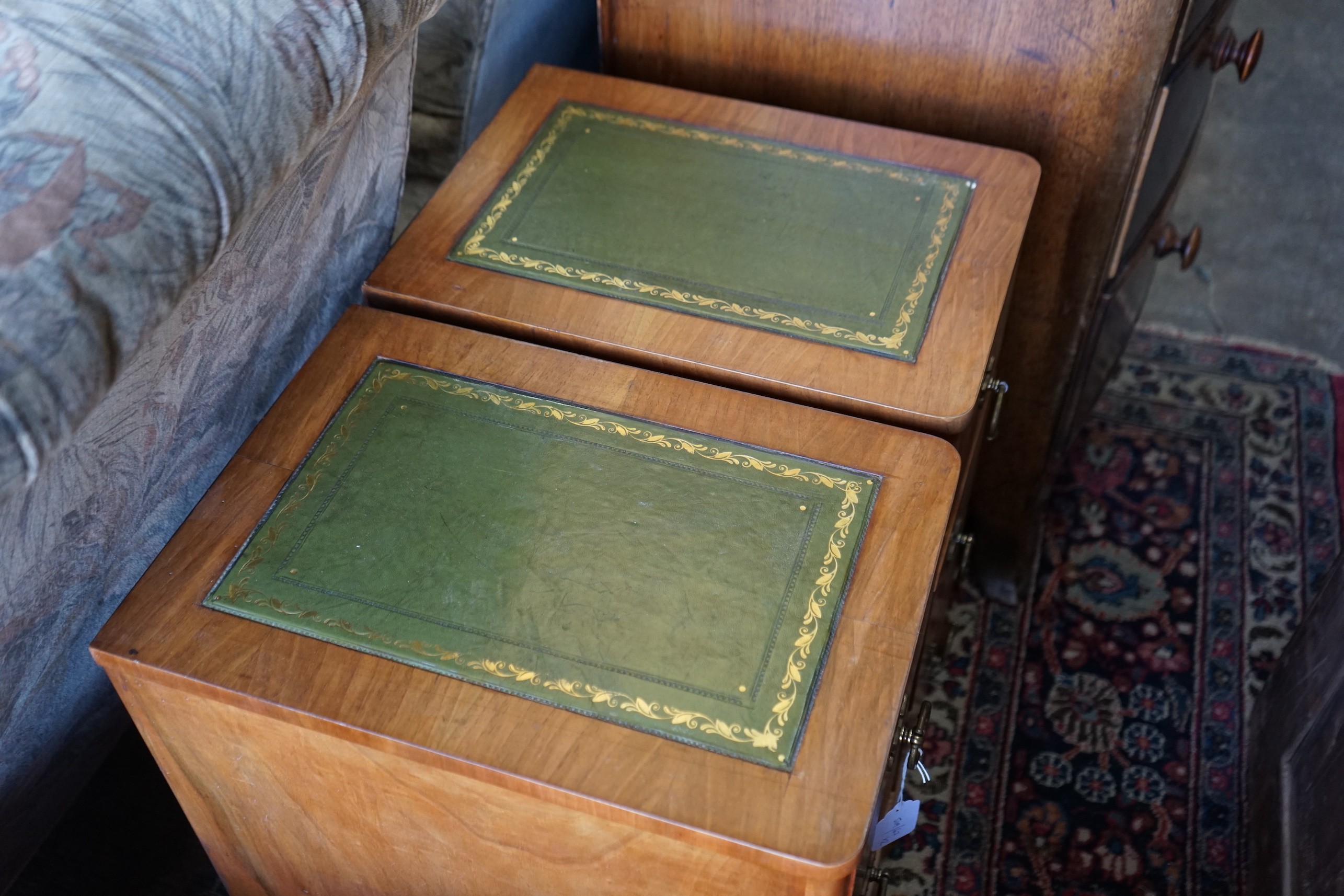 A pair of modern mahogany three drawer bedside chests, width 30cm, depth 44cm, height 63cm